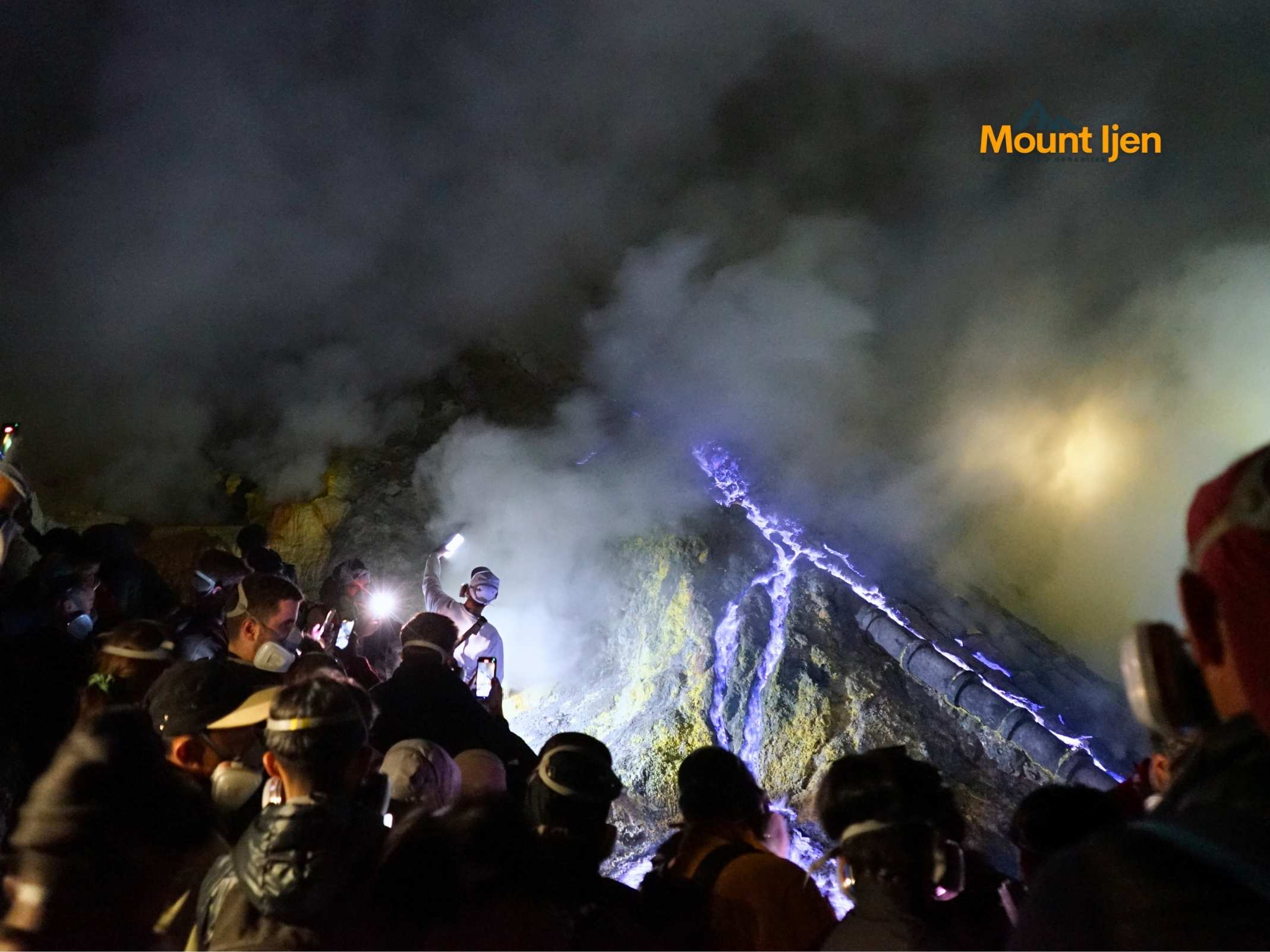 Hikers walking up Mount Ijen trail from Banyuwangi before dawn